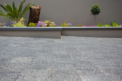 Exposed Aggregate Basalt Finish On Bosun Urban Medium Pavers